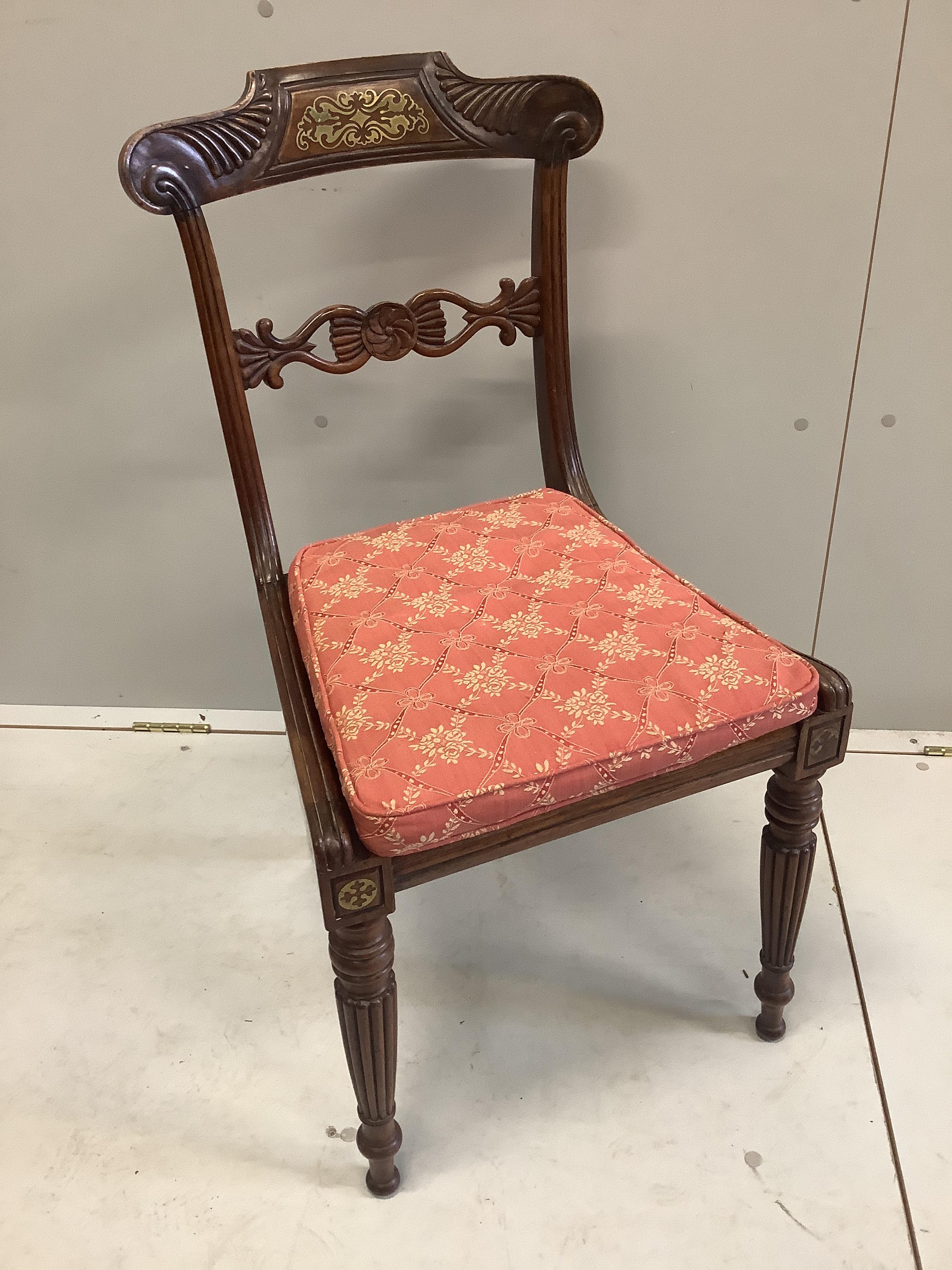 A set of eight Regency cut brass inlaid faded rosewood cane seat dining chairs, width 45cm, depth 40cm, height 88cm